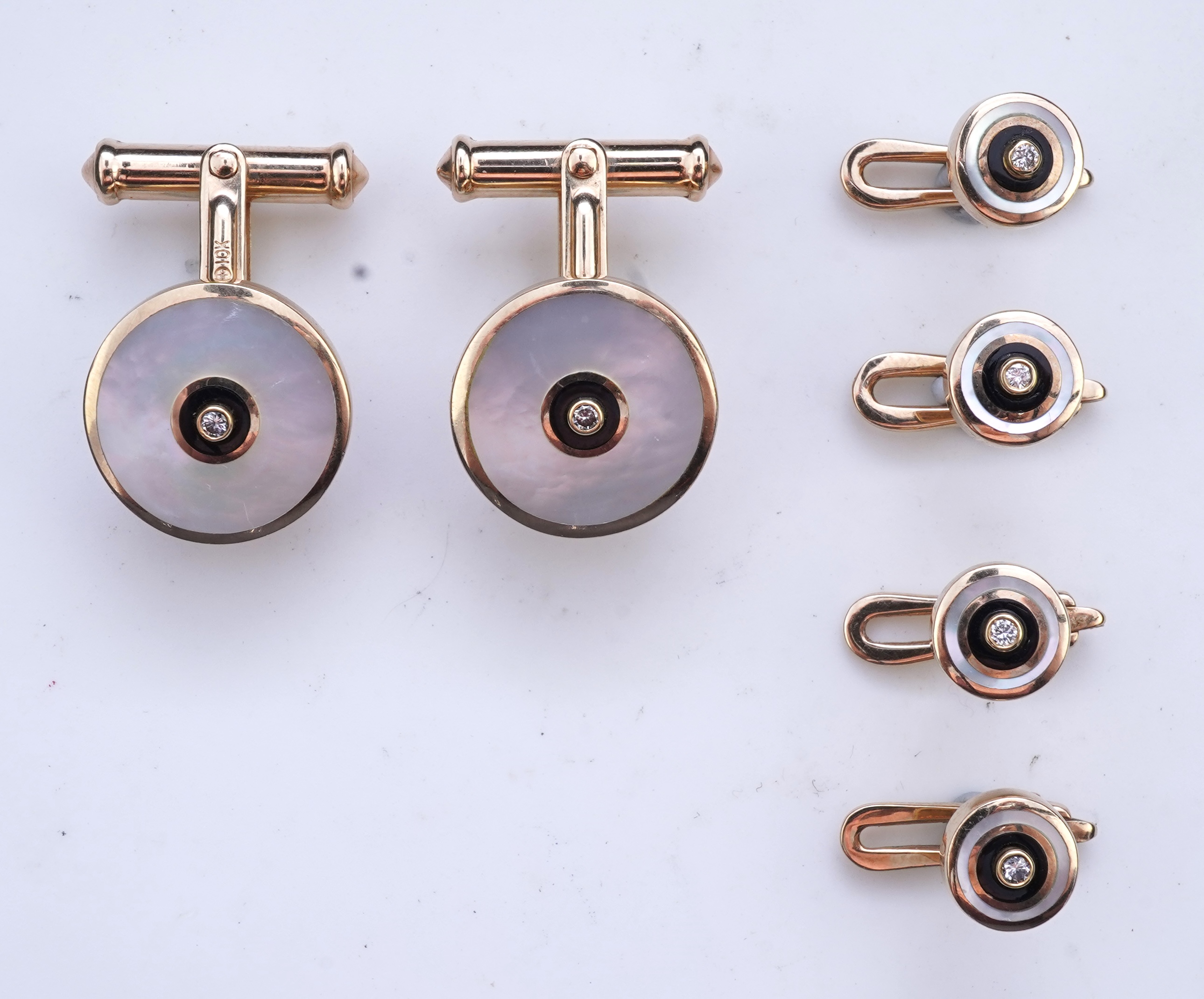 A mother of pearl and diamond dress set